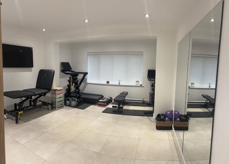 Inside the private physiotherapy treatment room at Cheryl Moulton Physiotherapy clinic in Lower Heswall, Wirral — a calm and discreet space for one-to-one treatment